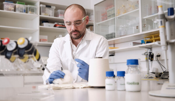 laboratory technician analysing cotton in lab 2