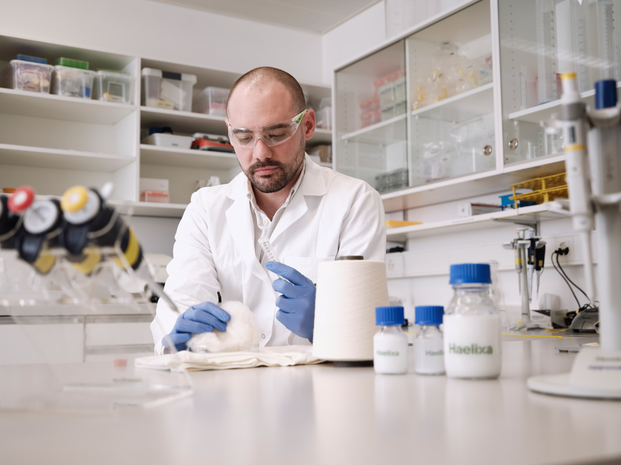 laboratory technician analysing cotton in lab 2