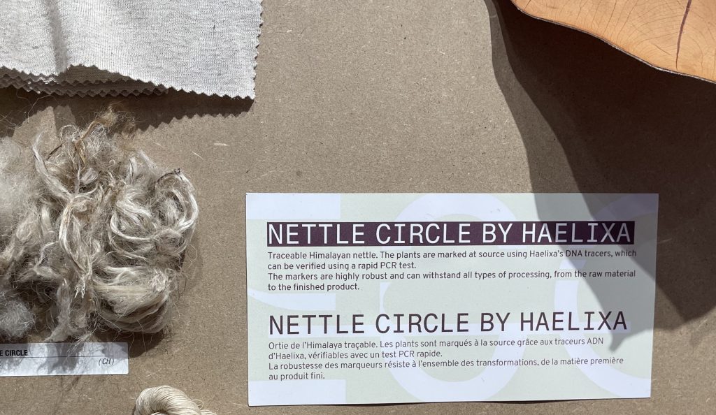 Himalayan nettle fibers with Nettle Circle by Haelixa label, showing DNA-based traceability for textiles