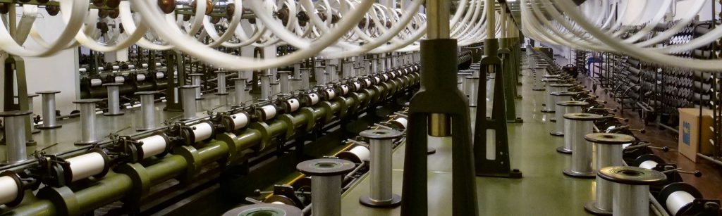 industrial silk yarn production with spinning machines, illustrating Haelixa’s traceability case study