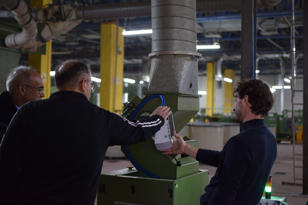 three men in factory